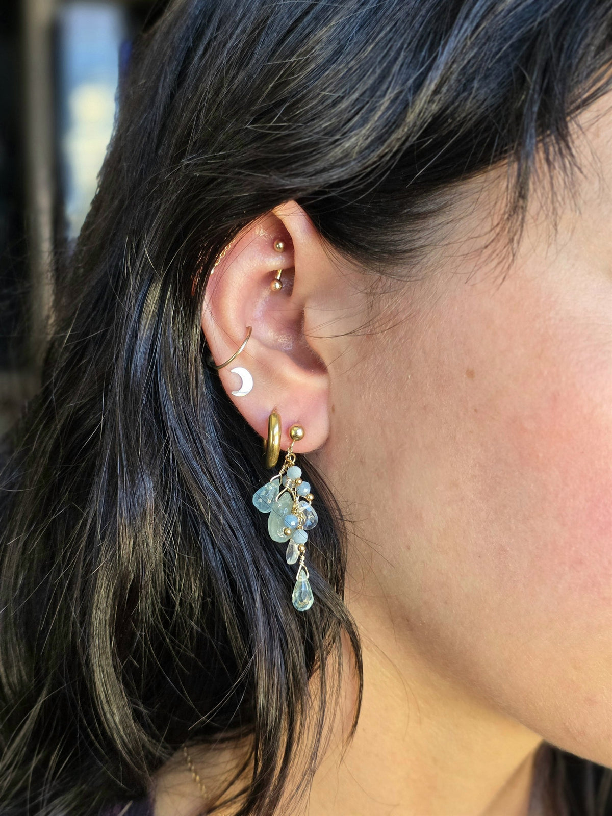 Aquamarine cluster earring worn, side view