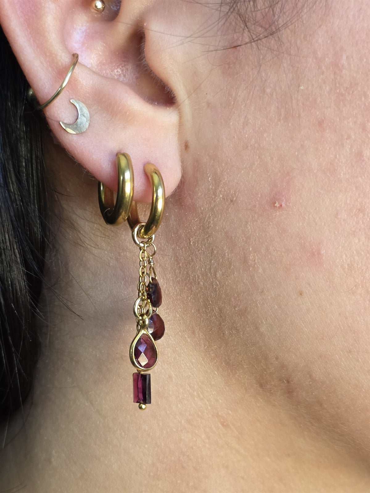 Garnet drop earring worn