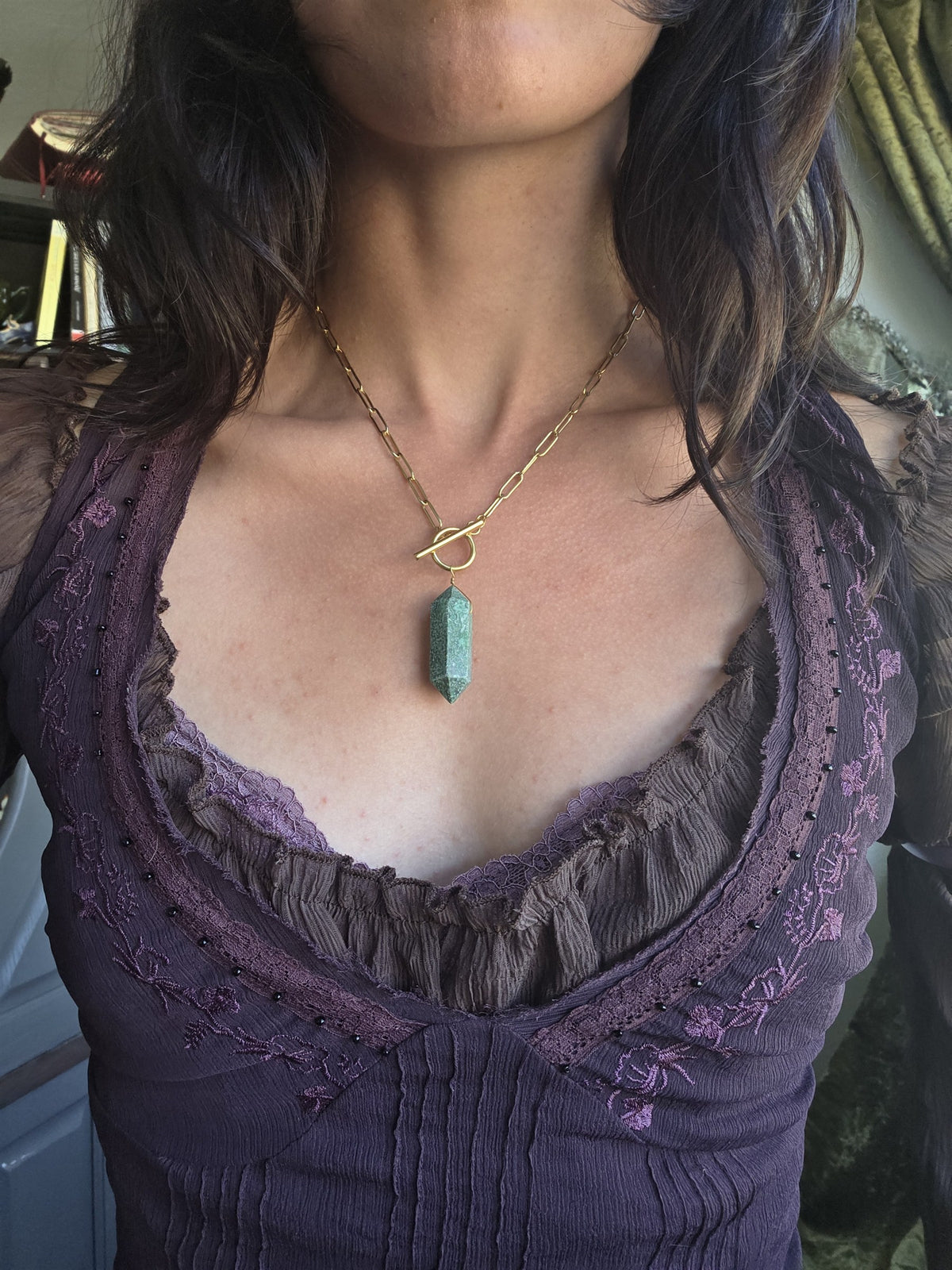 Jade single pendulum necklace, worn