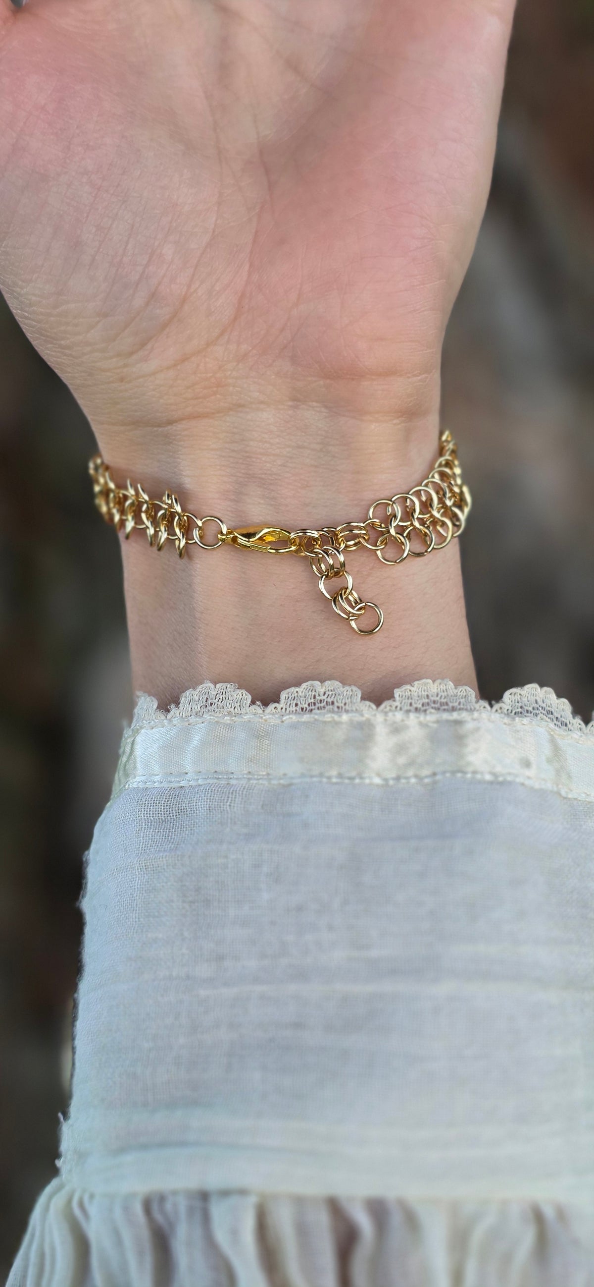 Clasp detail of the gold chainmaille hand chain