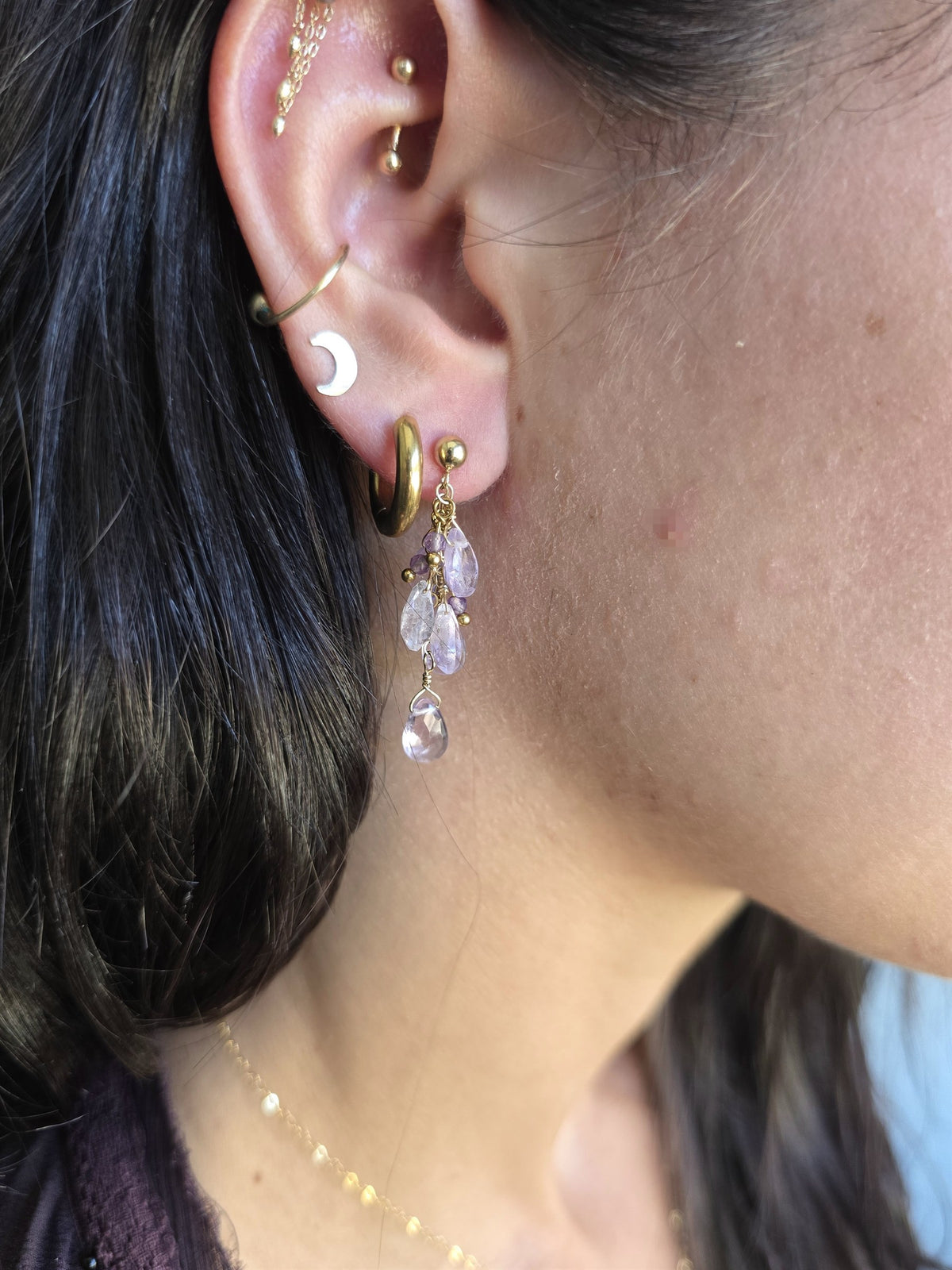 Amethyst cluster earring worn, close-up