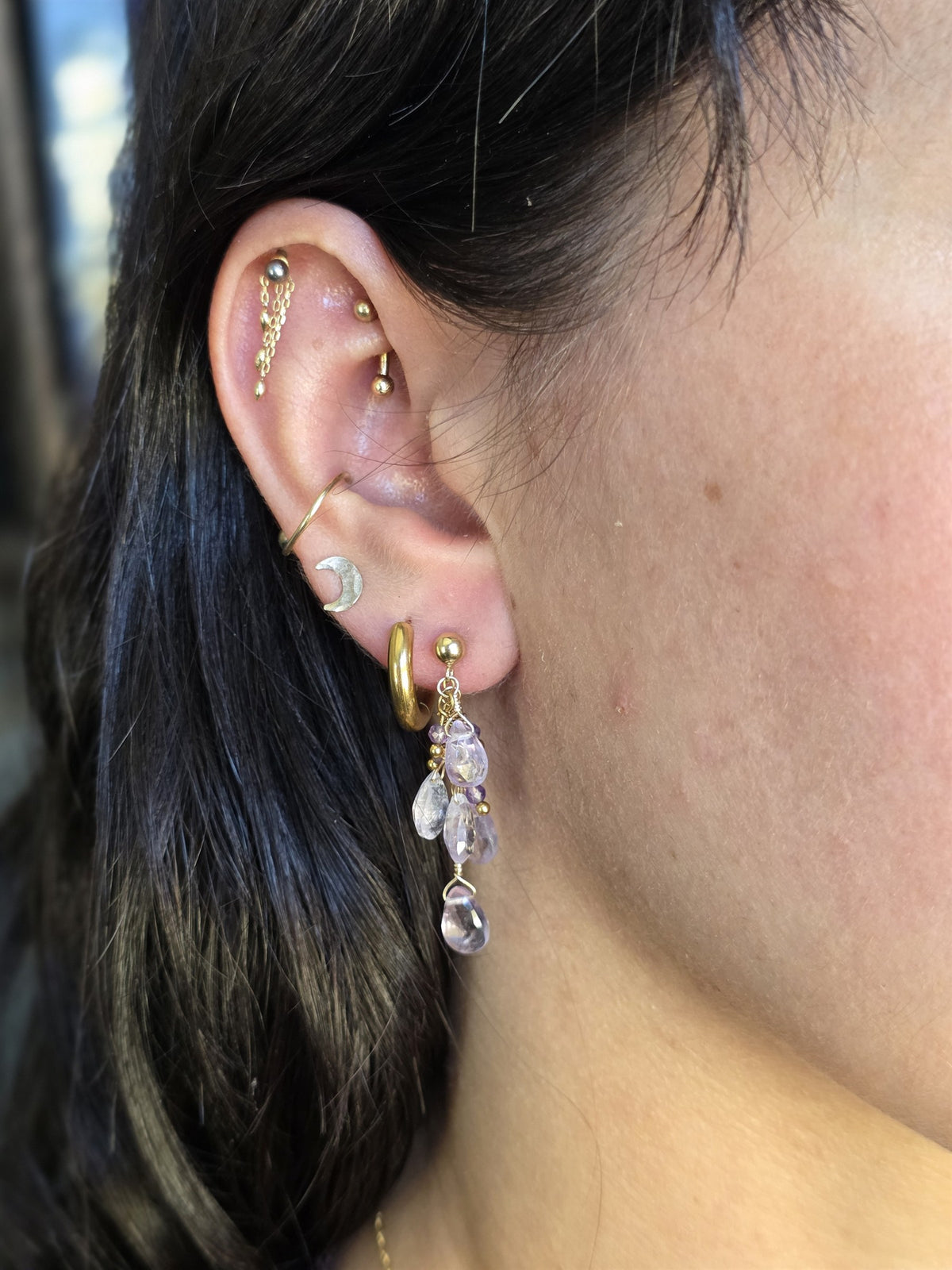 Amethyst cluster earring worn, showing length
