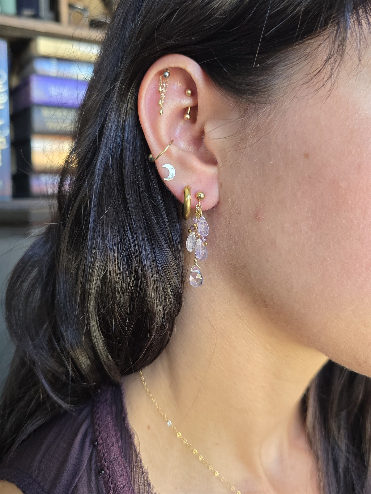 Amethyst cluster earring worn, profile view