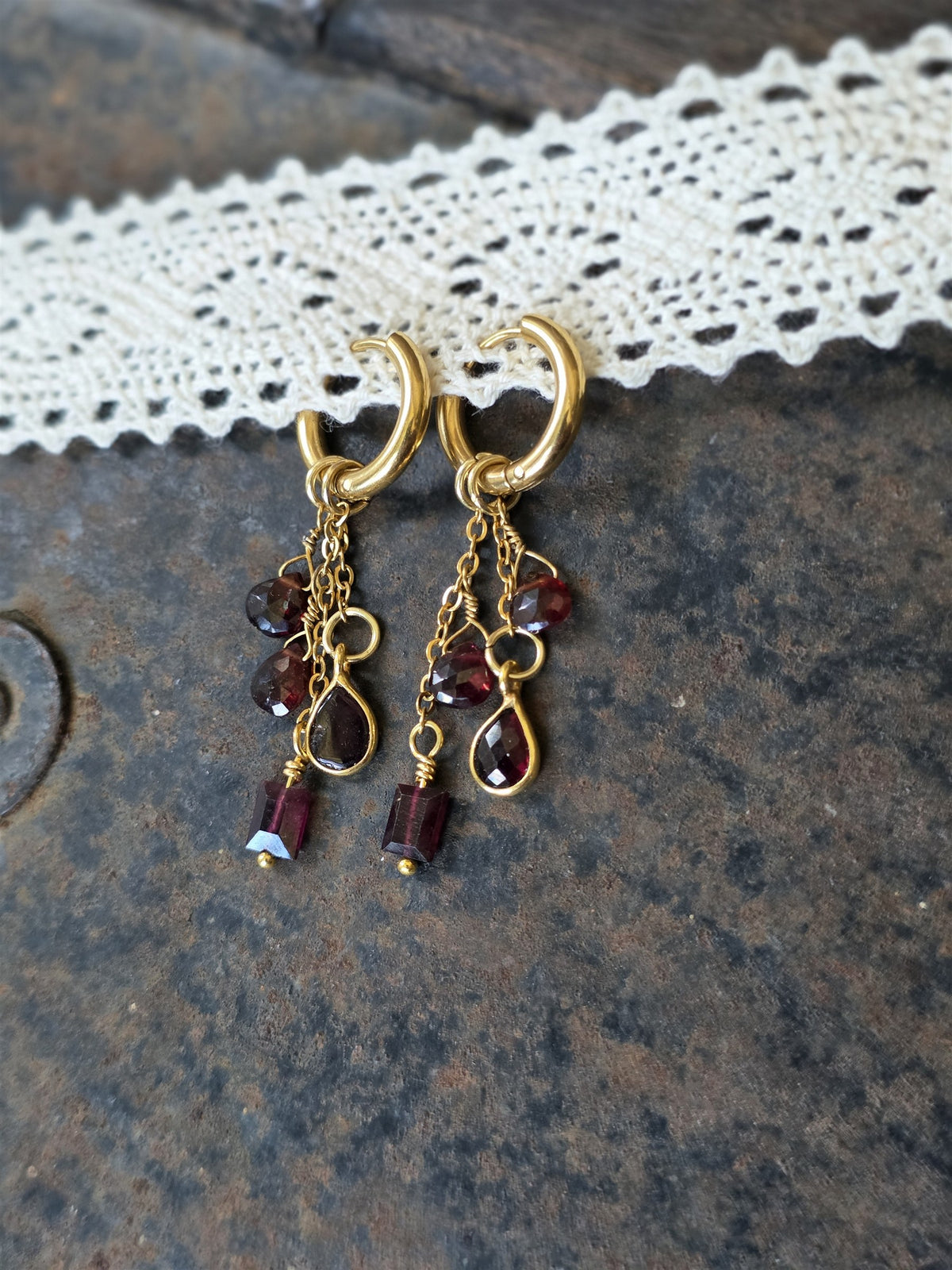 Autumn Ember garnet drop earrings on gold huggie hoops