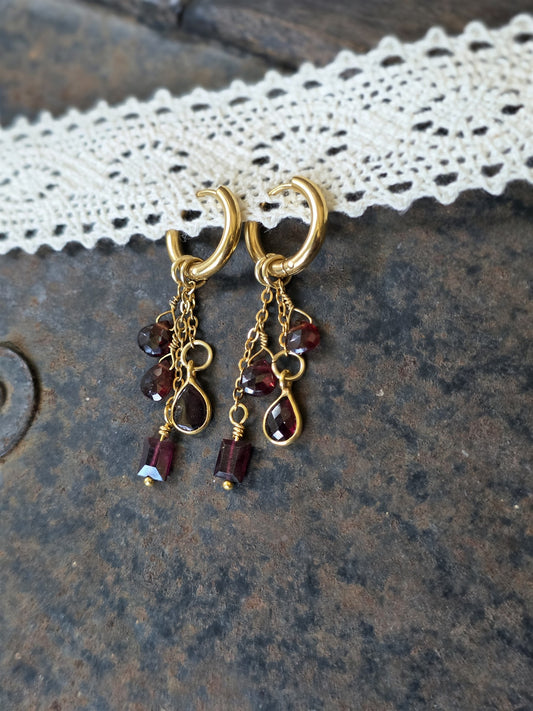 Autumn Ember garnet drop earrings on gold huggie hoops