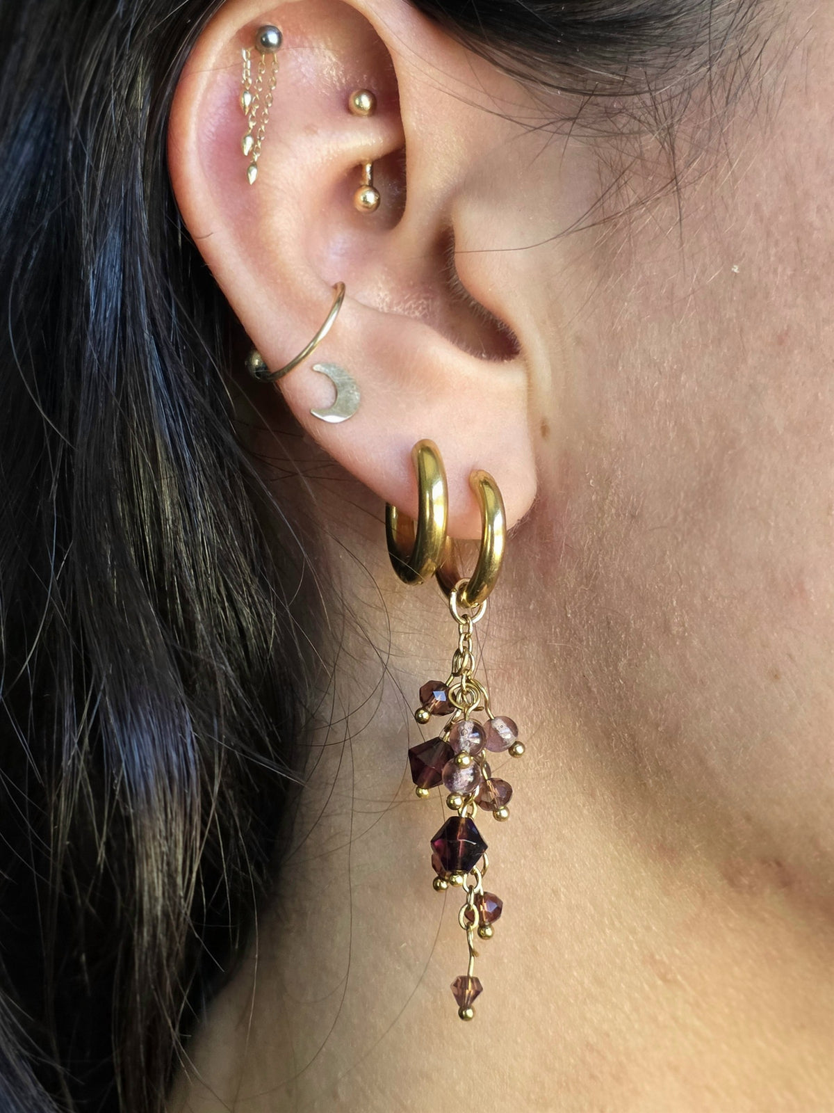Plum crystal cluster earring worn, side view