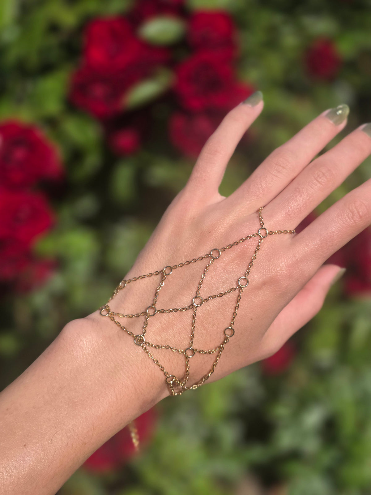 Gold lattice hand chain worn on the hand